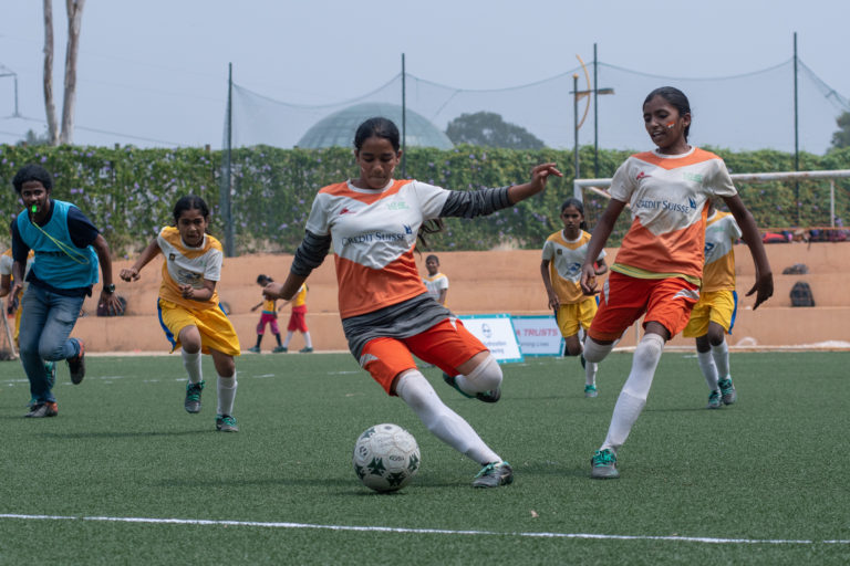 Girls playing football