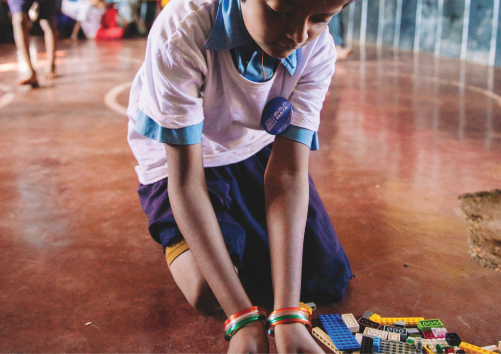 Spreading Joy through LEGO donations 1 A child playing with LEGO blocks