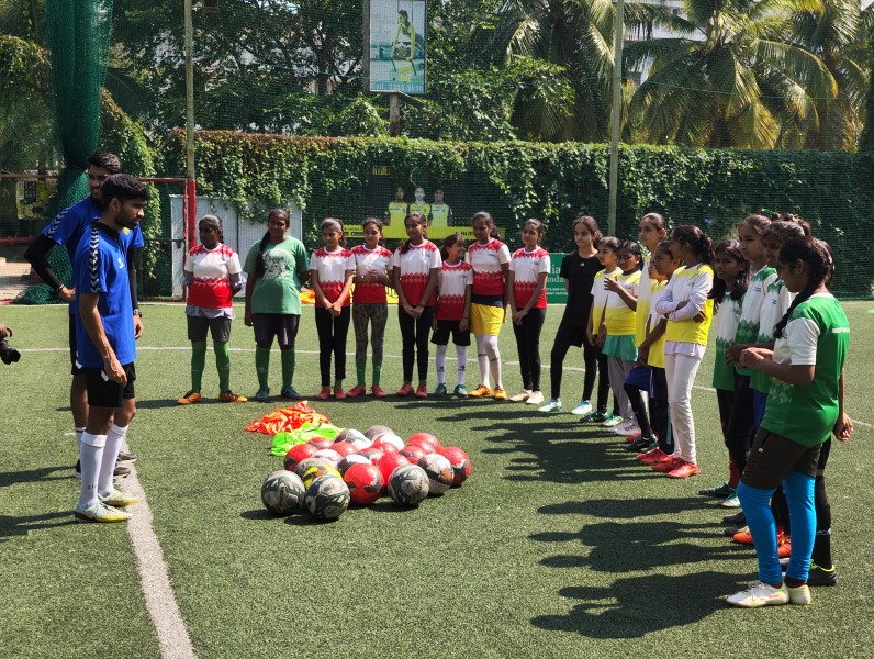 Girls from our Football program PLAY partaking in a football training session conducted by coaches form the Hyderabad FC team