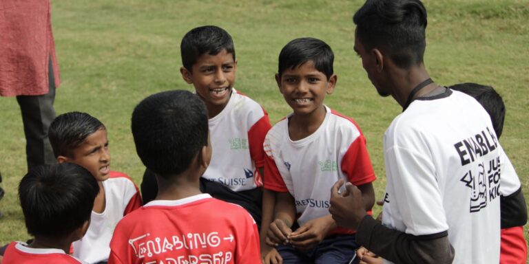Children with their Coach Abhishek during their league game in Pune