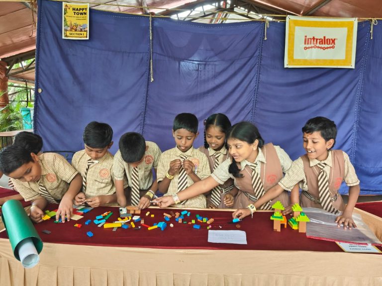 A group of Children setting up their LEGO model to present at the Enabling Leadership BUILD event in Bengaluru