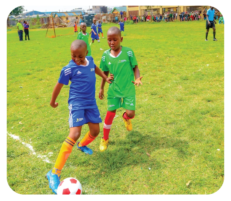 “Children collaborating in the EL Bridge Builders program to develop leadership and teamwork skills.”