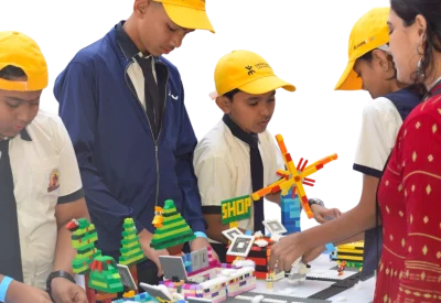 Children being mentored during their LEGO showcase session