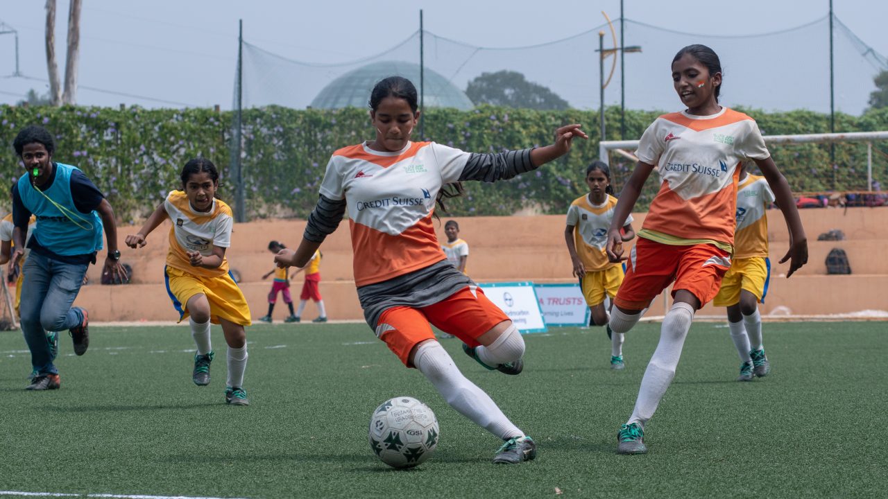 Girls playing football
